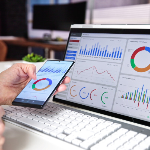 Photo of a mobile and a computer with tracking and analytics